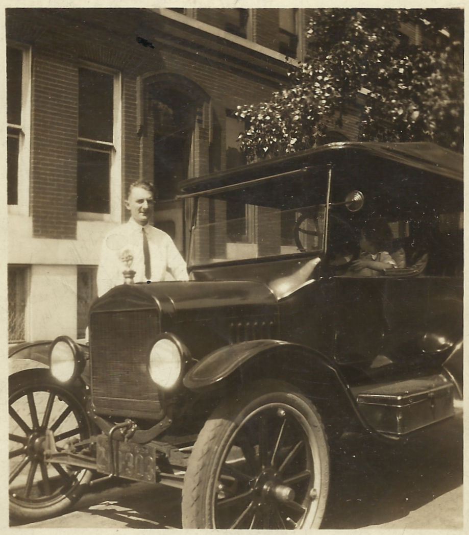 John Lewis Knickman S. in front of car